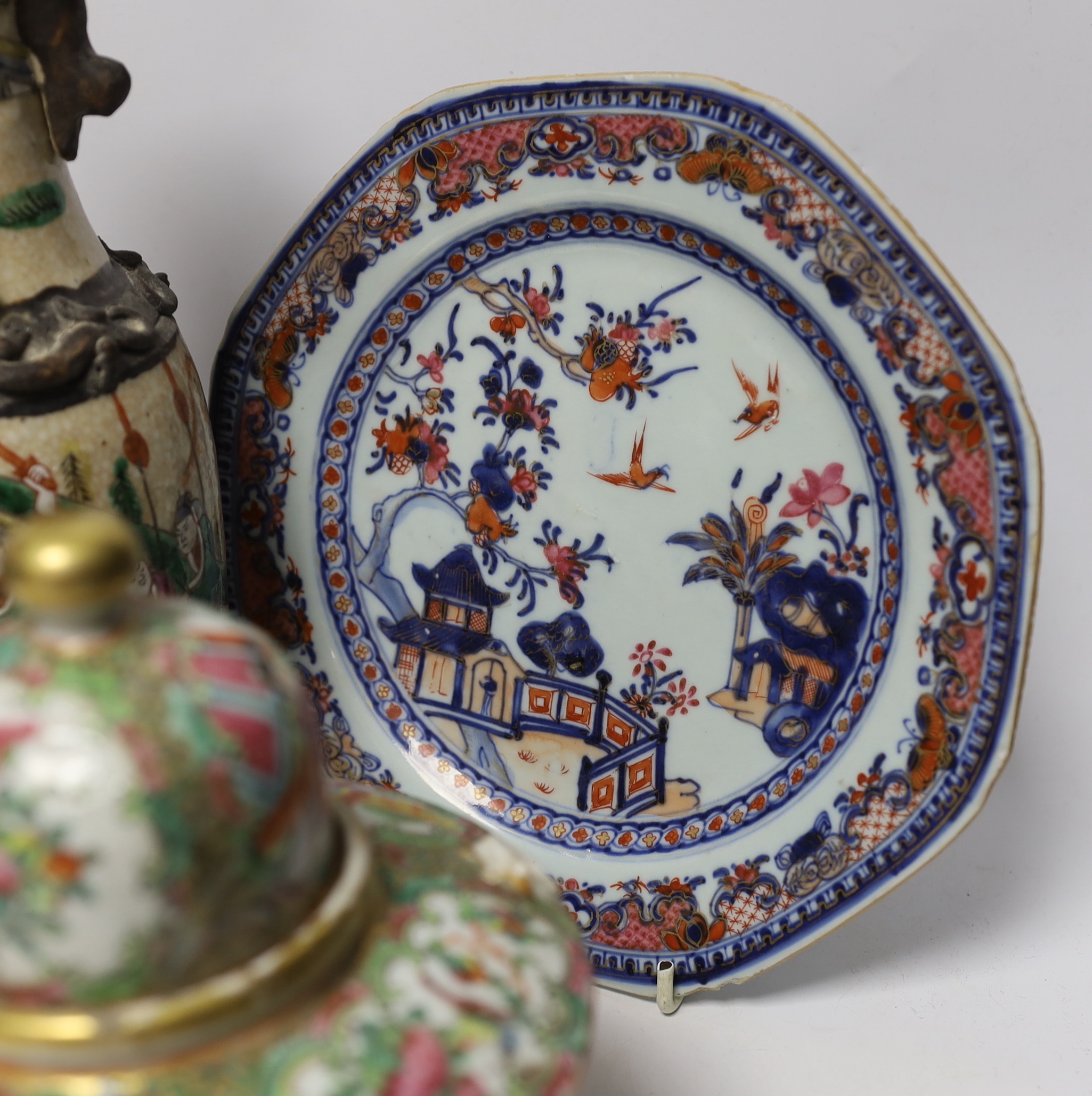 An 18th century Chinese export dish, a sang de boeuf squat vase, a crackle glaze bottle vase and a famille rose teapot, tallest 23cm